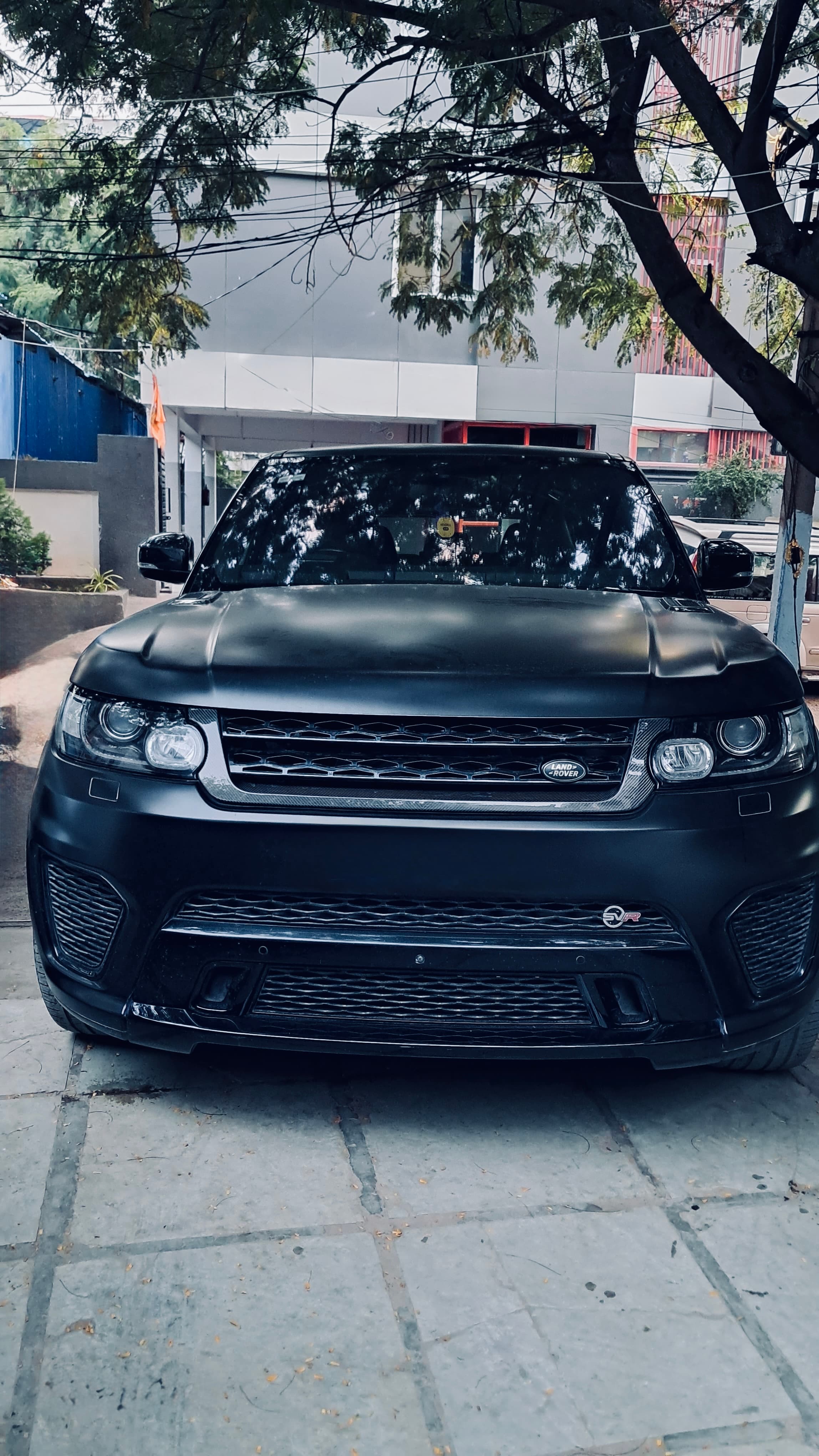 Black performance car in Code6 workshop